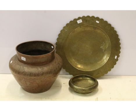 Persian repousse decorated planter, 38cm high, an Oriental brass platter, 55.5cm diameter and a Chinese brass shallow bowl of