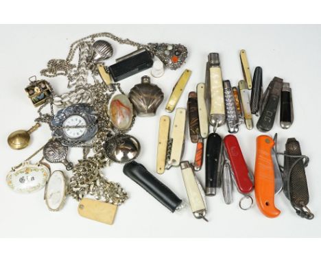 A small collection of vintage pocket knives together with a group of mixed collectables to include pocket lighters and costum
