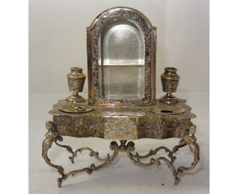 A Late 19th Century German Silver Novelty Inkstand:
circa 1890, modelled as an 18th century side table/cabinet, the central g