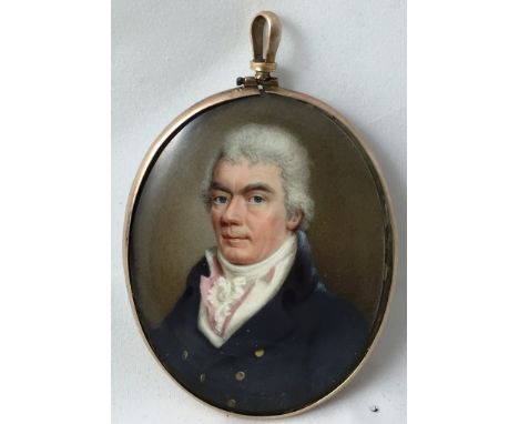 J.T. Mitchell (British, active 1798-1830):
A portrait miniature of a gentleman in a blue jacket, signed centre left, inscribe