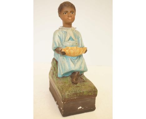 An early 20th century ceramic nodding money bank, 33cm