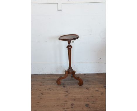 A George III mahogany tripod table with beaded tray top, turned tapering stem and tripod legs.  11ins diameter.  