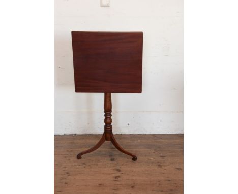 A Victorian mahogany rectangular tilt top tripod table on turned stem and tripod legs.  20¼ by 18½ins.  