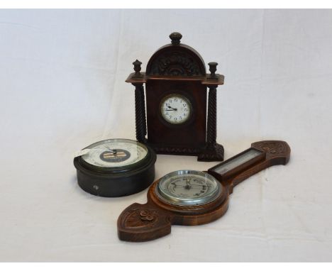 A mahogany cased mantel clock with arched acanthus leaf carved pediment above quadruple twist carved columns, the dial with A