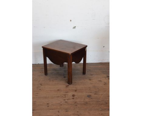 A George III mahogany commode stool with hinged lid above a shaped apron and square chamfered legs.  20ins wide.  
