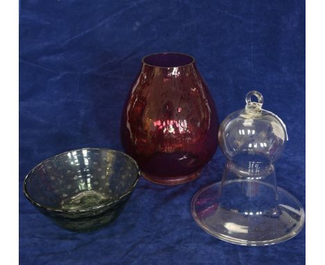 A glass ceiling protector for an oil lamp. A puce glass oil lamp shade. A large fruit bowl.  A green glass ditto and a flower