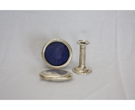 An Edward VII silver candlestick on a stepped circular foot.  Birmingham 1905. Makers IS Greenberg & Co.  A late Victorian ci