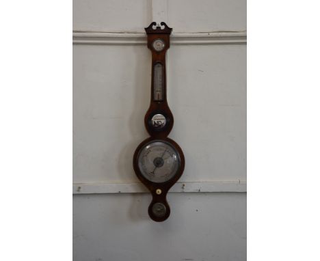 A 19th century mahogany and boxwood strung barometer, thermometer, hygrometer with broken scroll pediment and central convex 