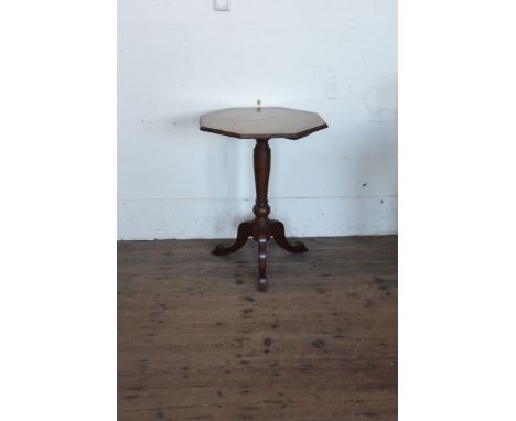 A Victorian walnut octagonal top occasional table on reeded tapering turned stem, tripod legs and pad feet.  21¾ins wide.  