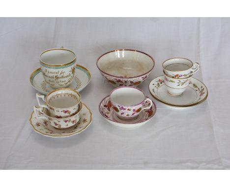 A 19th century tea cup, saucer and slop bowl decorated with stylised strawberries surrounded by puce lustre leaves.  A 19th c