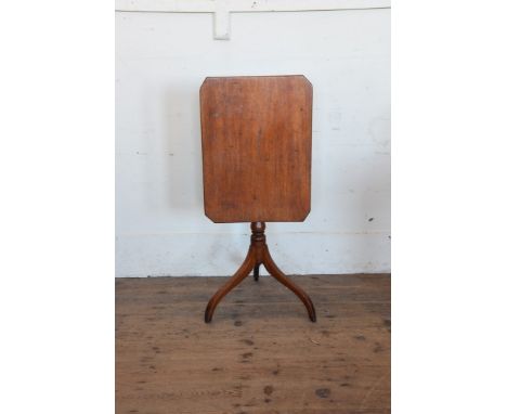 A late George III mahogany tripod table with rectangular top on a turned stem and tripod legs.  17½ by 23½ins.  