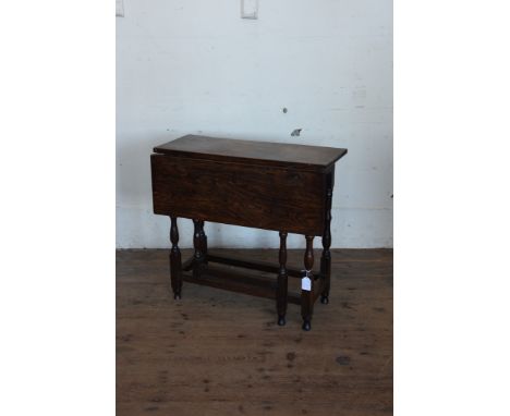 A late 17th century oak one-leaf gate-leg table on turned supports and flattened stretchers.  29ins wide.  