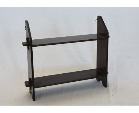 An oak travelling shelf with canted side supports and two shelves.  19in wide. 