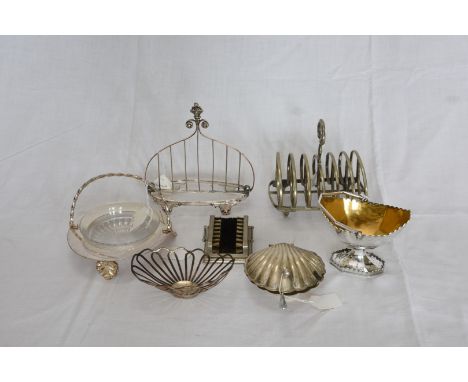 A plated six slice toast rack with loop finial. A plate on copper toast rack with stylised flower head decorated finial.  A p