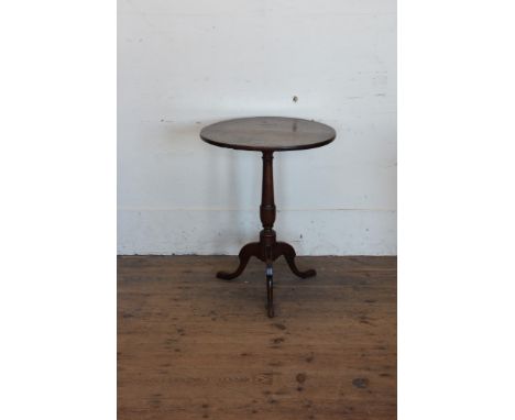 A 19th century oak circular top occasional table on turned stem, tripod legs and pad feet.  20½ins diameter.  