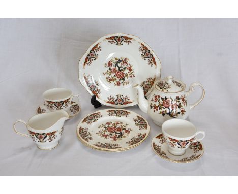 A Colclough dinner and tea service decorated in the Imari style with stylised flower heads comprising thirty-one dinner plate