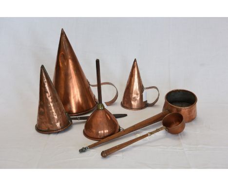 A large copper beer muller.  Three smaller ditto.  A copper funnel.  A copper ladle and a copper tot.  