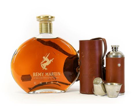 Rémy Martin Extra Fine Champagne Cognac, 70cl in decanter together with a leather cased Remy Martin flask and travelling cups