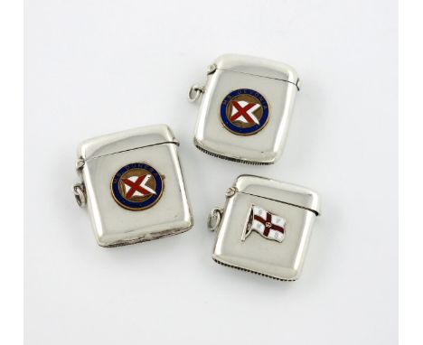 Three Edwardian silver and enamel vesta cases, plain rectangular form, with a ring attachment, comprising: one by Saunders & 