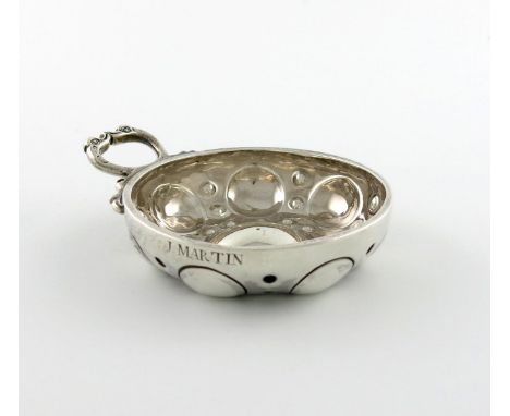 A 19th century French silver wine taster, maker's mark of ?M in a lozenge, circular form, punch bead decoration, double snake