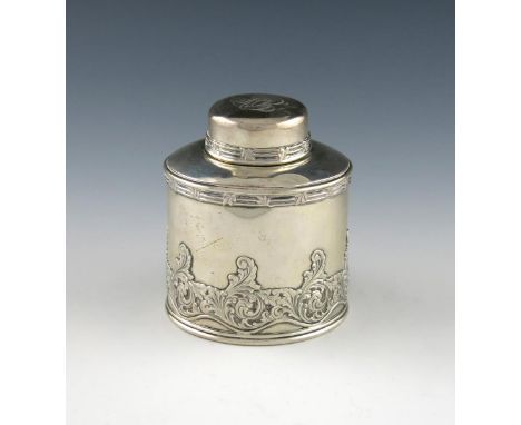 An American silver tea caddy, by Tiffany and Co, Charles Cook period, 1902-7, circular form, applied with a band of foliate s