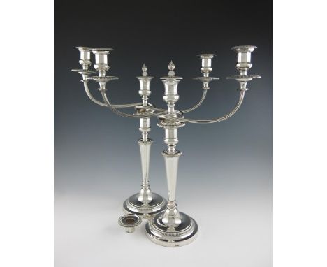 A pair of early 19th century old Sheffield plated three-light candelabra, by Matthew Boulton, circa 1820, tapering circular c