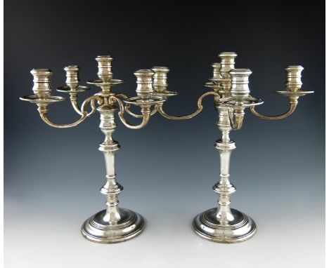 A pair of modern silver five-light candelabra, by R. Comyns, London 1965, in the George I manner, knopped stems, on raised ci