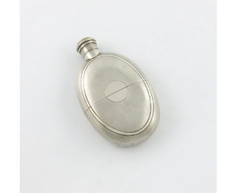 A Victorian silver hip flask, makers mark JB, retailed by Leuchars & Son, London 1867, oval form, engine turned decoration, w