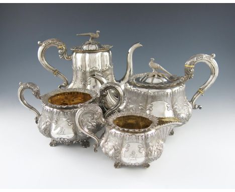 λA four-piece William IV silver tea and coffee set, by Benoni Stephens, London 1835, lobed baluster form, embossed with scene