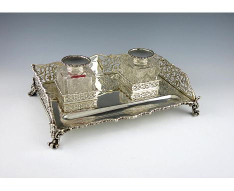 A Victorian silver double inkstand, by The Barnards, London 1892, rectangular form, with pierced foliate scroll gallery, gadr