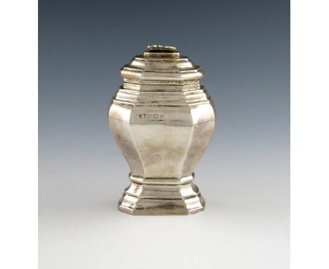 A silver tea caddy, by S. Blanckensee and Sons, Birmingham 1917, in the George I manner, panelled baluster form, the hinged c