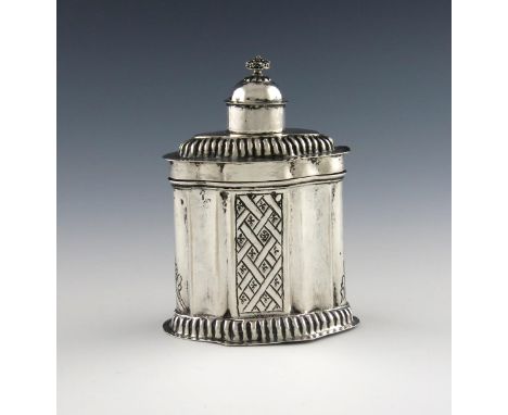 An 18th century German silver tea caddy, Bamberg,  shaped oval form, with two panels of chased lattice decoration, fluted bor
