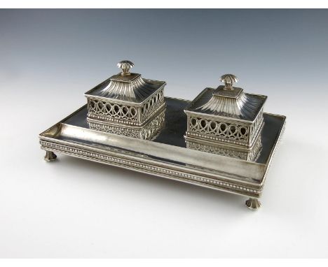 By Omar Ramsden, an Arts and Crafts silver inkwell, London 1930, the underside inscribed 'OMAR RAMSDEN ME FECIT', rectangular