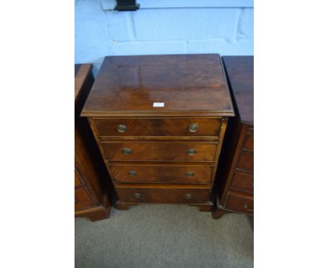 Reproduction mahogany chest of moulded edge over four graduated full width drawers on bracket feet, 56cm wide