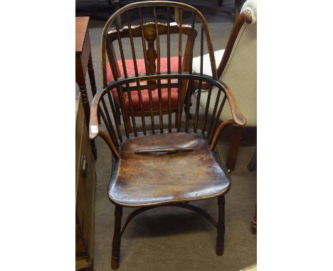 Yew and elm stick back Windsor style armchair with solid seat, splayed supports joined by a crinoline stretcher