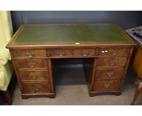 Early 20th century mahogany twin pedestal desk with gilt tooled leather inset over three frieze drawers raised on two pedesta