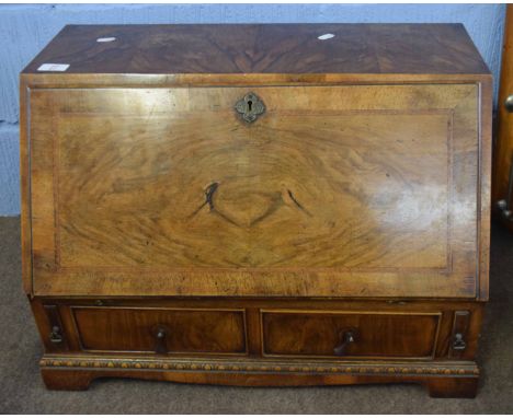 Good quality reproduction small table top bureau, fall front enclosing fitted interior with drawers below on bracket feet, 61