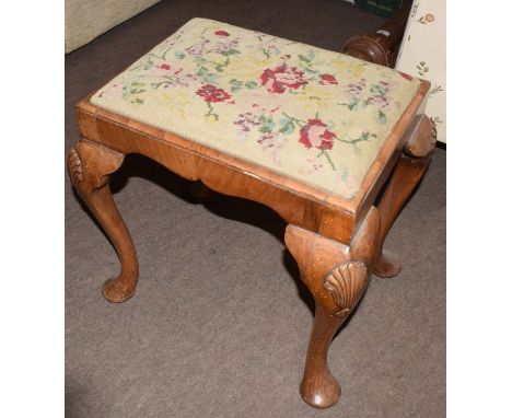 Group of three stools, the first: Queen Anne style in walnut on four shell carved cabriole legs with worn inset wool work flo