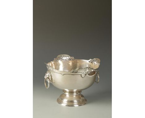 A ROSE BOWL of circular tapering form with pierced borders and lions mask ring handles, on a reeded circular foot, by Walker 