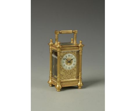 A FRENCH BRASS CASED CARRIAGE CLOCK, the cream chapter ring with Arabic numerals surrounded by a gilt fret work mask, the bac