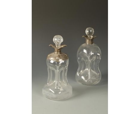 A SILVER MOUNTED DECANTER with a waisted glass body, silver collar and a pull-out stopper, by William Hutton & Sons Ltd, Birm