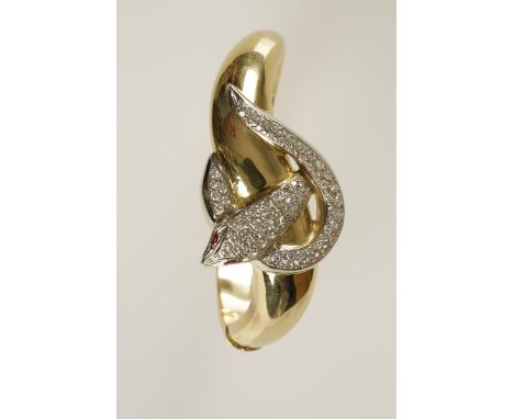 AN 18CT GOLD AND DIAMOND SNAKE BANGLE, the entwined head and tail pave-set with brilliant-cut diamonds, with marquise-shaped 