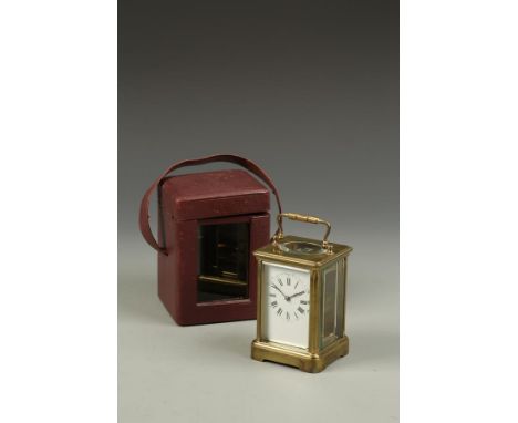 A FRENCH BRASS CASED CARRIAGE CLOCK, the white enamelled dial with Roman numerals, inscribed 'Fair Thoughts and Happy Hours a