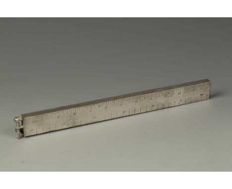 A DUNHILL SILVER-PLATED LIGHTER in the form of a 12" ruler, with engraved inscription "Rotol and British Messier"