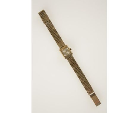 ACCURIST: A LADIES 9CT YELLOW GOLD WRISTWATCH, the square dial with baton numerals, inscribed "Accurist", attached to a 9ct y