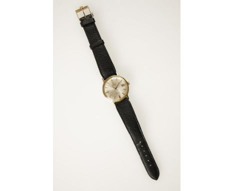 OMEGA: A GENTLEMAN'S UNMARKED YELLOW AND WHITE METAL WRISTWATCH, the round dial with raised baton numerals, date aperture and