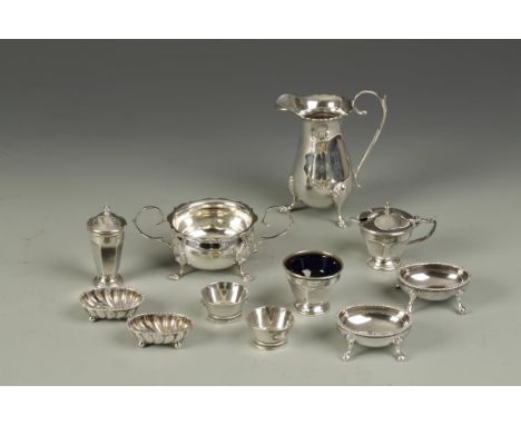 A QUANTITY OF CONDIMENTS including a pair of Victorian salt cellars of oval form, by Hilliard & Thomason, Birmingham 1878, to