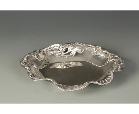 A LATE VICTORIAN DISH of shaped oval form, the border embossed with shells and scrolls, by Martin Hall & Co., Sheffield 1897,