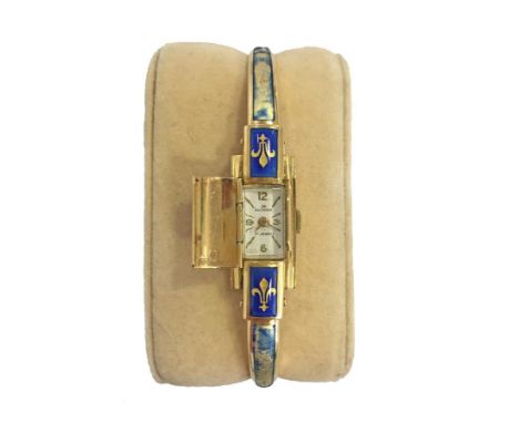 BUCHERER: A LADIES 18K YELLOW GOLD AND ENAMEL WRISTWATCH, the rectangular dial with Arabic and gilt baton numerals, the dial 