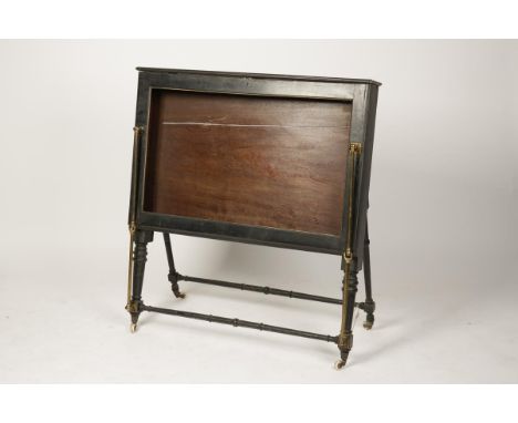 A LATE VICTORIAN AESTHETIC PERIOD FOLIO STAND with a hinged cover on gilt metal hinges and outswept turned legs with ceramic 